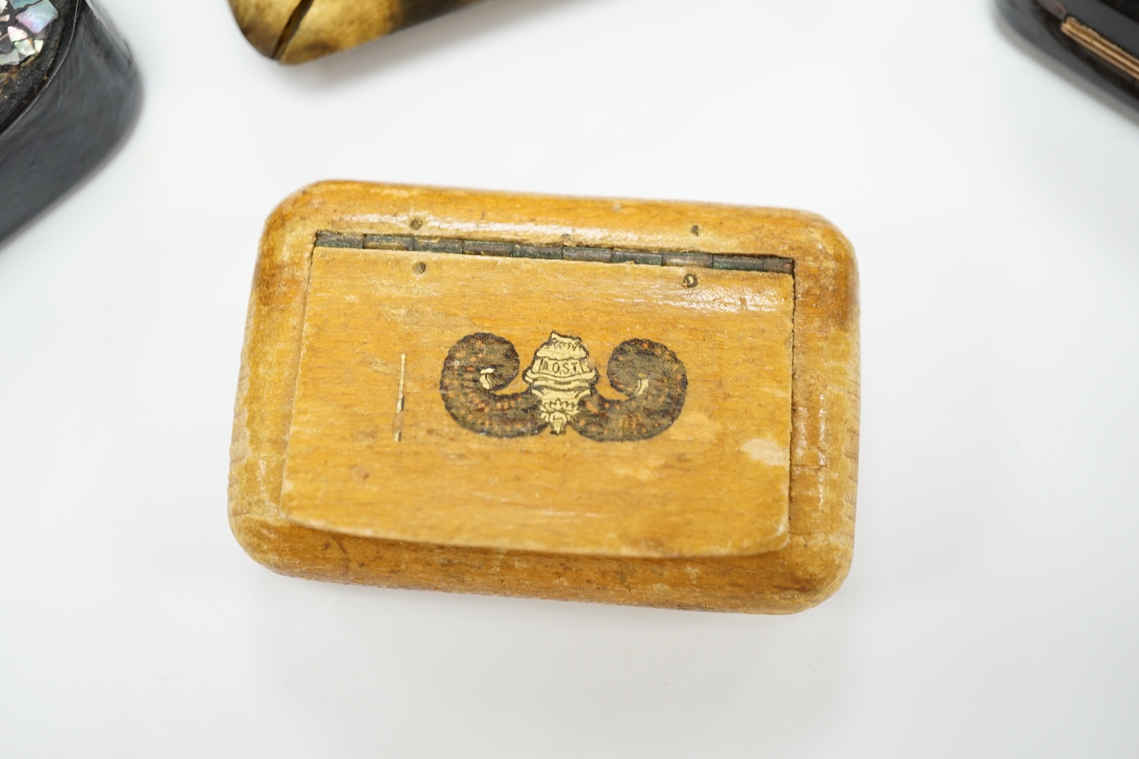 Five 19th century snuff boxes including horn and papier-mache examples, largest 7.5cm wide